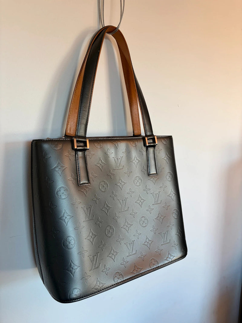 Louis Vuitton grey tote bag embossed monogram, metallic sheen, silver-tone hardware.