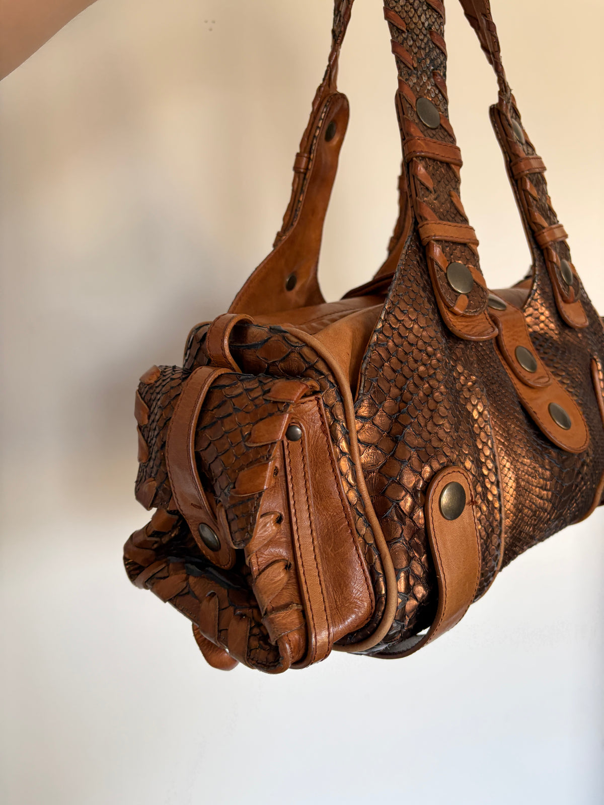 Chloé Silverado bag in metallic bronze python with whipstitched handles and studs