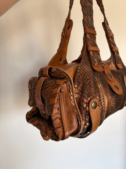 Chloé Silverado bag in metallic bronze python with whipstitched handles and studs