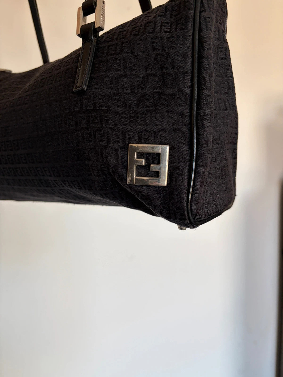 Fendi black shoulder bag with Zucchino monogram canvas, silver-tone hardware, and leather trim.