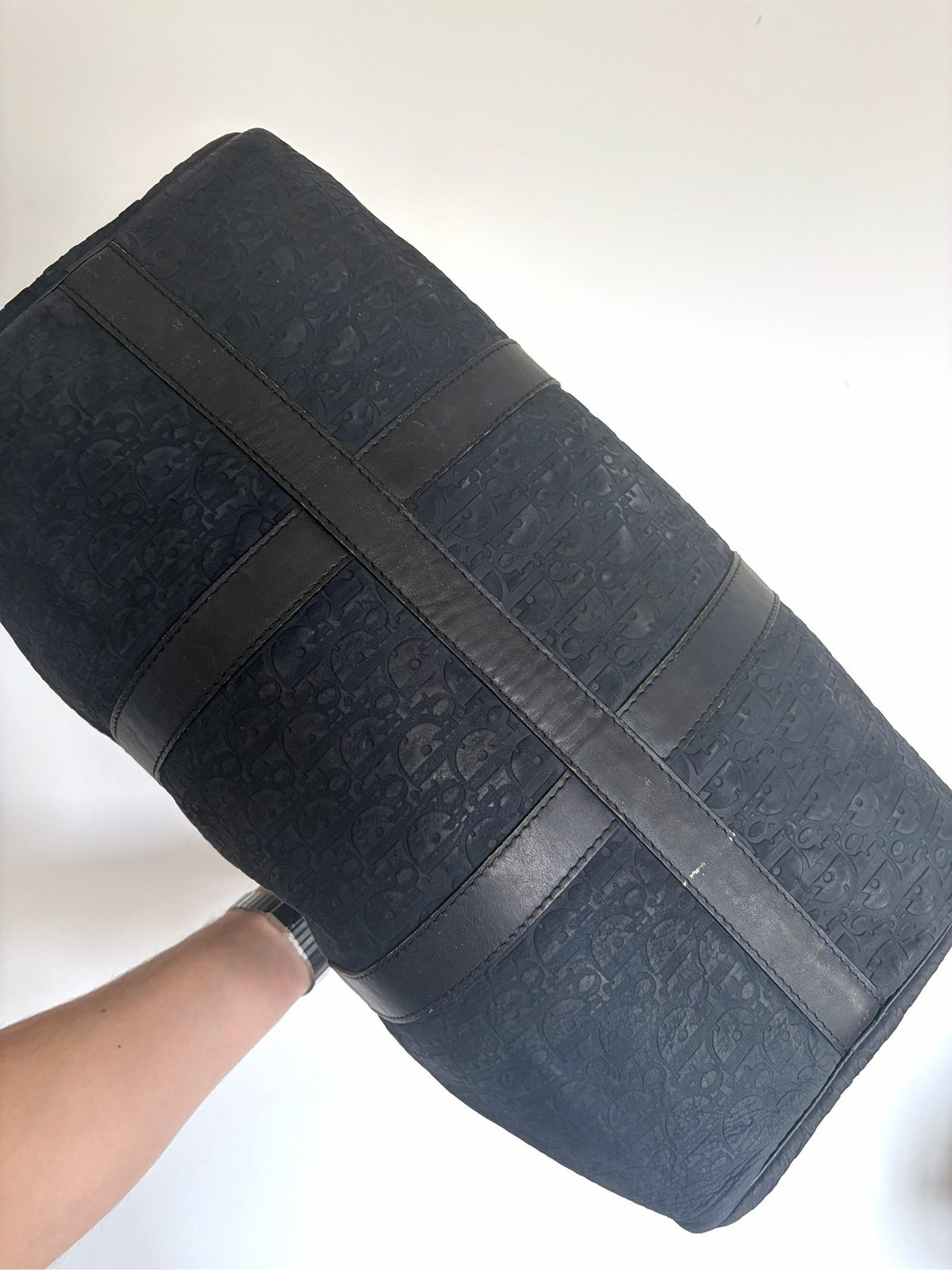 Christian Dior black duffel bag embossed jacquard fabric with leather trim and handles.