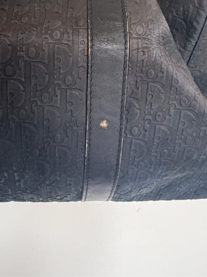 Christian Dior black duffel bag embossed jacquard fabric with leather trim and handles.