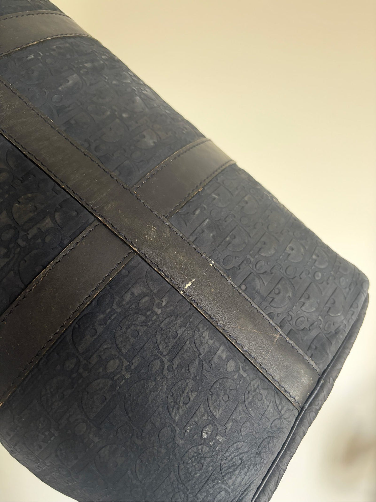 Christian Dior black duffel bag embossed jacquard fabric with leather trim and handles.