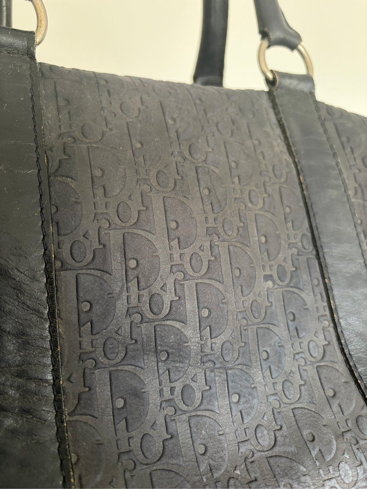 Christian Dior black duffel bag embossed jacquard fabric with leather trim and handles.