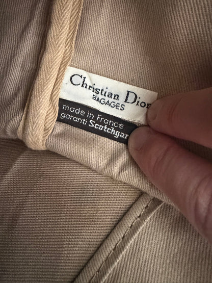 Christian Dior black duffel bag embossed jacquard fabric with leather trim and handles.