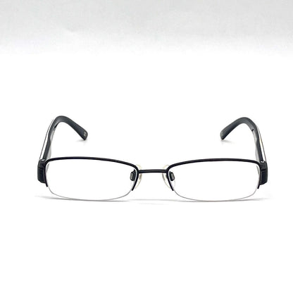 Chanel black rectangular rimless eyeglasses with white CC detailing and adjustable nose pads.