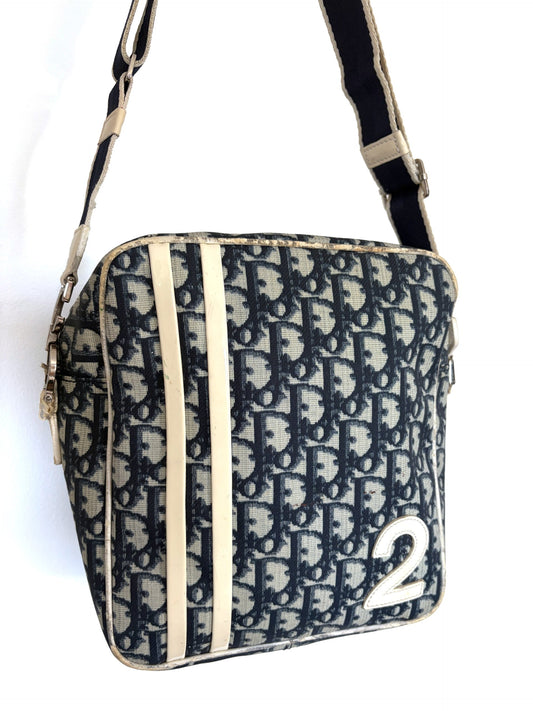 Christian Dior beige and navy crossbody bag with Trotter monogram and leather trim.